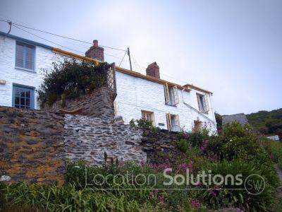 Cottage above cove and harbour